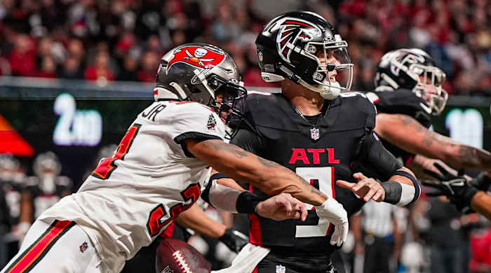 Tampa Bay Buccaneers safety Antoine Winfield Jr. knocks the ball out of the hand of Atlanta Falcons quarterback Desmond Ridder.